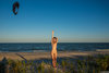 Happy Nudist Beauty Undressing on the Beach