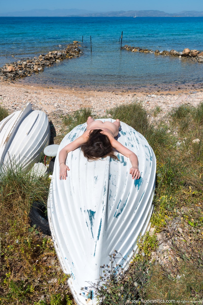 Nudist Woman Sunbathing on Boat at Seaside