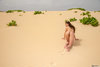 Naturist Girl Crawling on Sand Dunes Desert