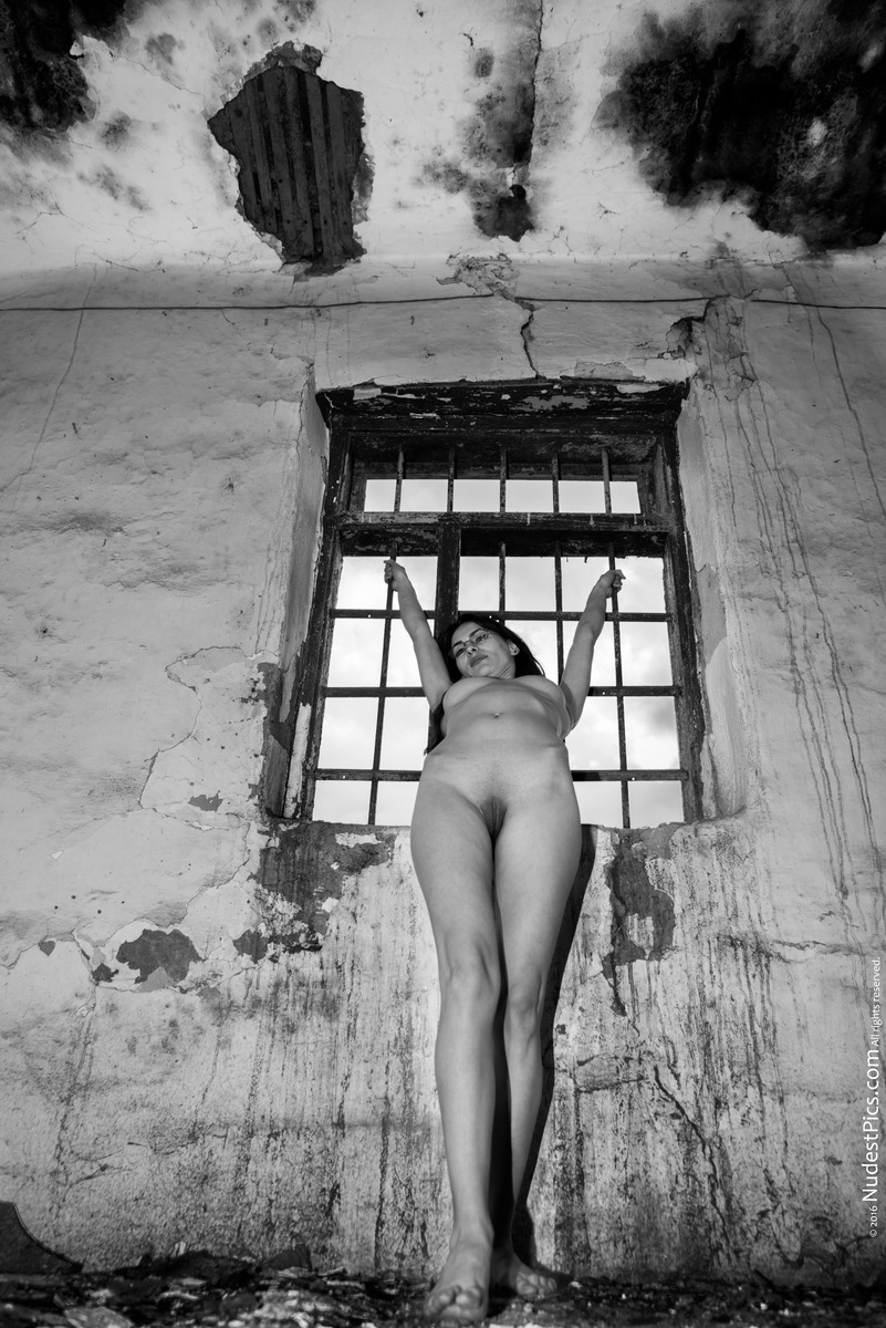 Naked Nerdy Gal in Dirty Ravaged Old Prison B&W