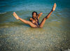 Black Nudist Young Woman Legs Up in the Water